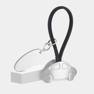 LLAVERO AUTO CON PLACA fabricado en hule y metal con área de grabado láser para logotipos corporativos.