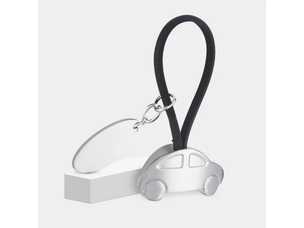 LLAVERO AUTO CON PLACA fabricado en hule y metal con área de grabado láser para logotipos corporativos.