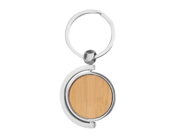 Llavero de bambú SPIN circular con estructura giratoria 360 grados, detalles metálicos y estuche de regalo.