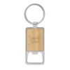 Llavero destapador KIDRINK con estructura metálica brillante, panel de bambú barnizado y estuche de regalo con terciopelo.