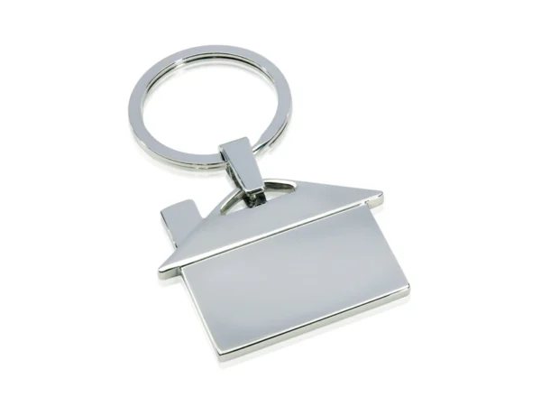 LLAVERO METÁLICO CASA en forma de casa con acabado pulido y estuche de regalo individual para fuerza de ventas.