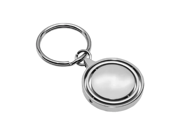Llavero Terra circular de metal con superficie interior giratoria y estuche de regalo individual.