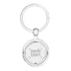 Llavero Terra circular de metal con superficie interior giratoria y estuche de regalo individual.
