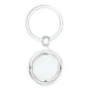 Llavero Terra circular de metal con superficie interior giratoria y estuche de regalo individual.