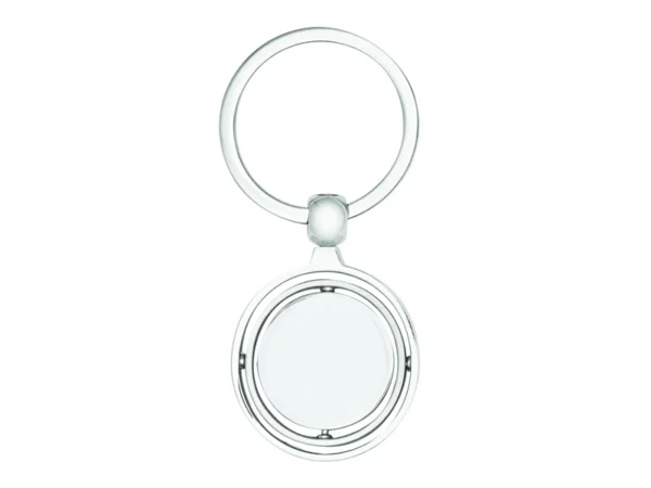 Llavero Terra circular de metal con superficie interior giratoria y estuche de regalo individual.