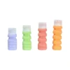 Set de 4 botellas expandibles personalizado con logo para viajes corporativos Dot Factory Querétaro.