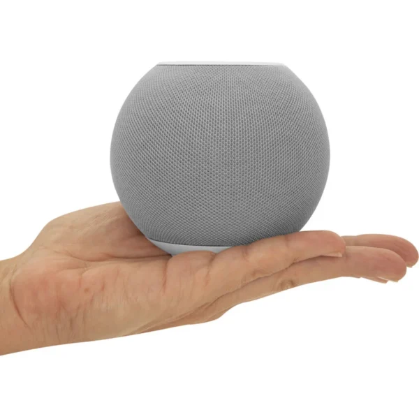 Bocina portátil con conexión bluetooth en color negro y gris sobre superficie
